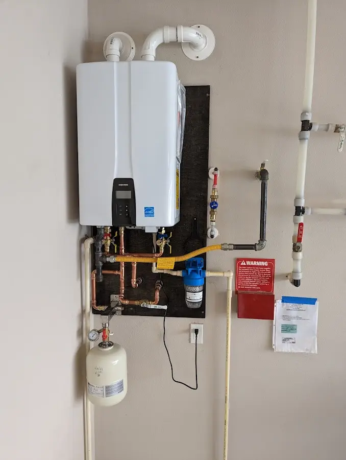 Professional plumber installing copper piping in a Collingdale home